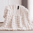 Soft bubble texture electric heated blanket draped on chair
